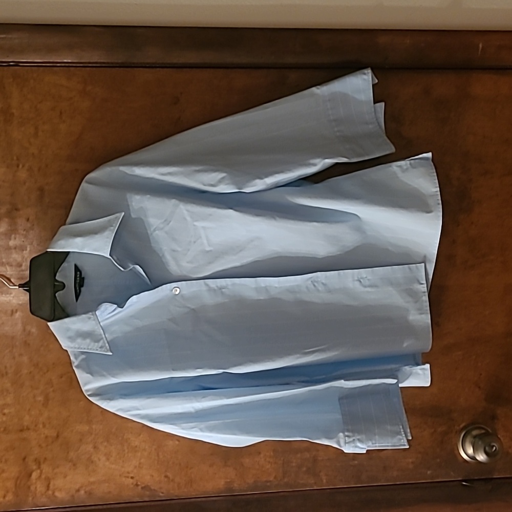 Light blue and white vertical striped button-down blouse.